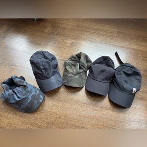 (3) Lulu Lemon, (1) Athleta & (1) On Cloud Cap, all never worn.